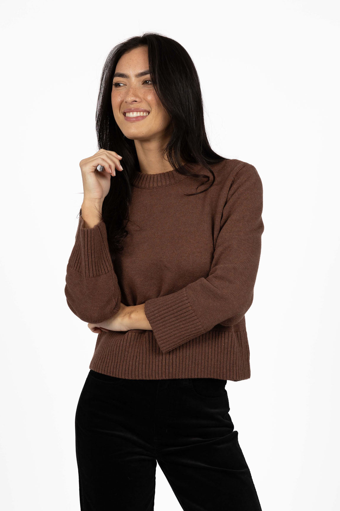 Image of Woman wearing a Humidity Mocha sweater on a white background