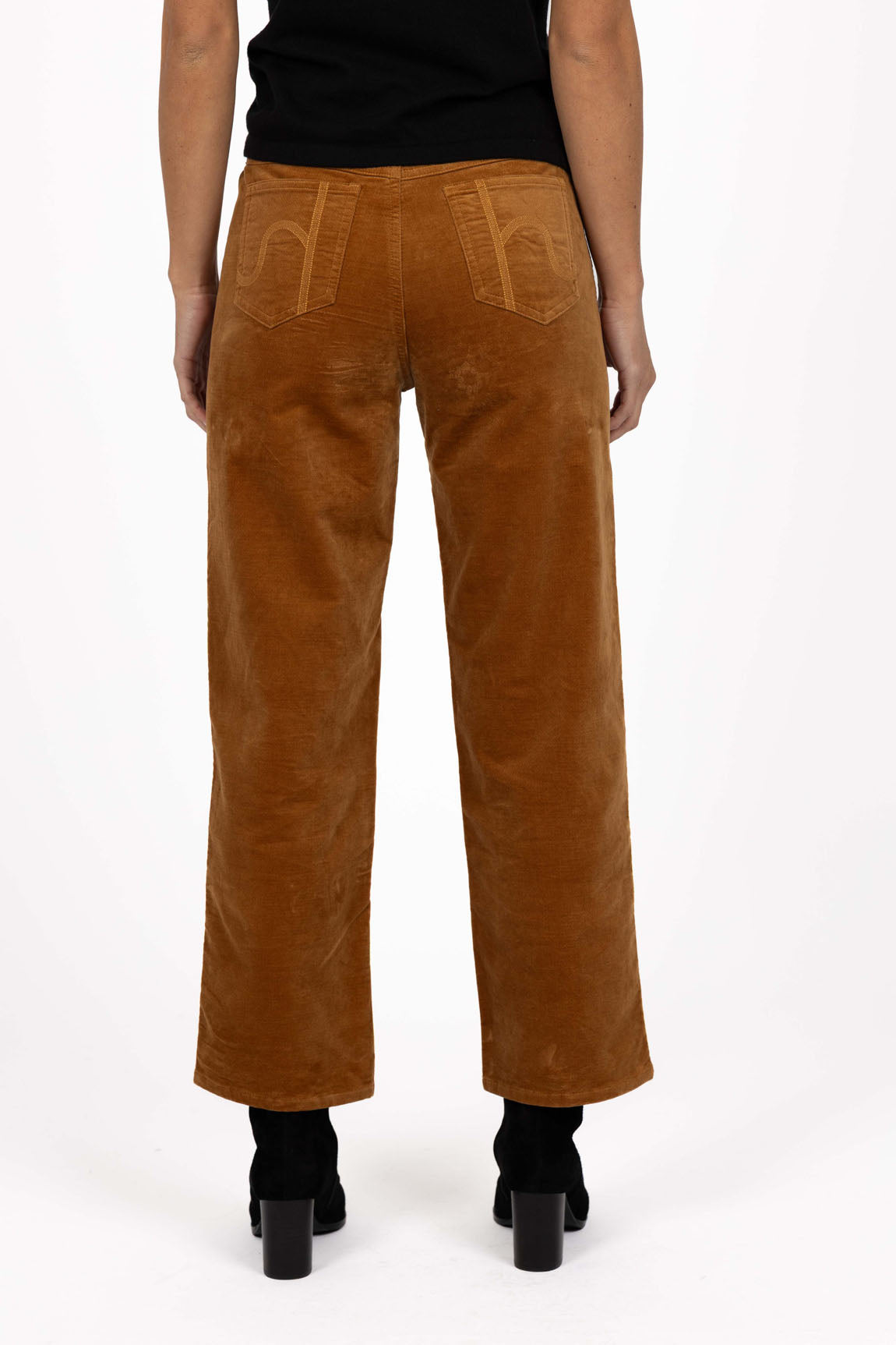 Image of Woman wearing Humidity pants paired with a black top 