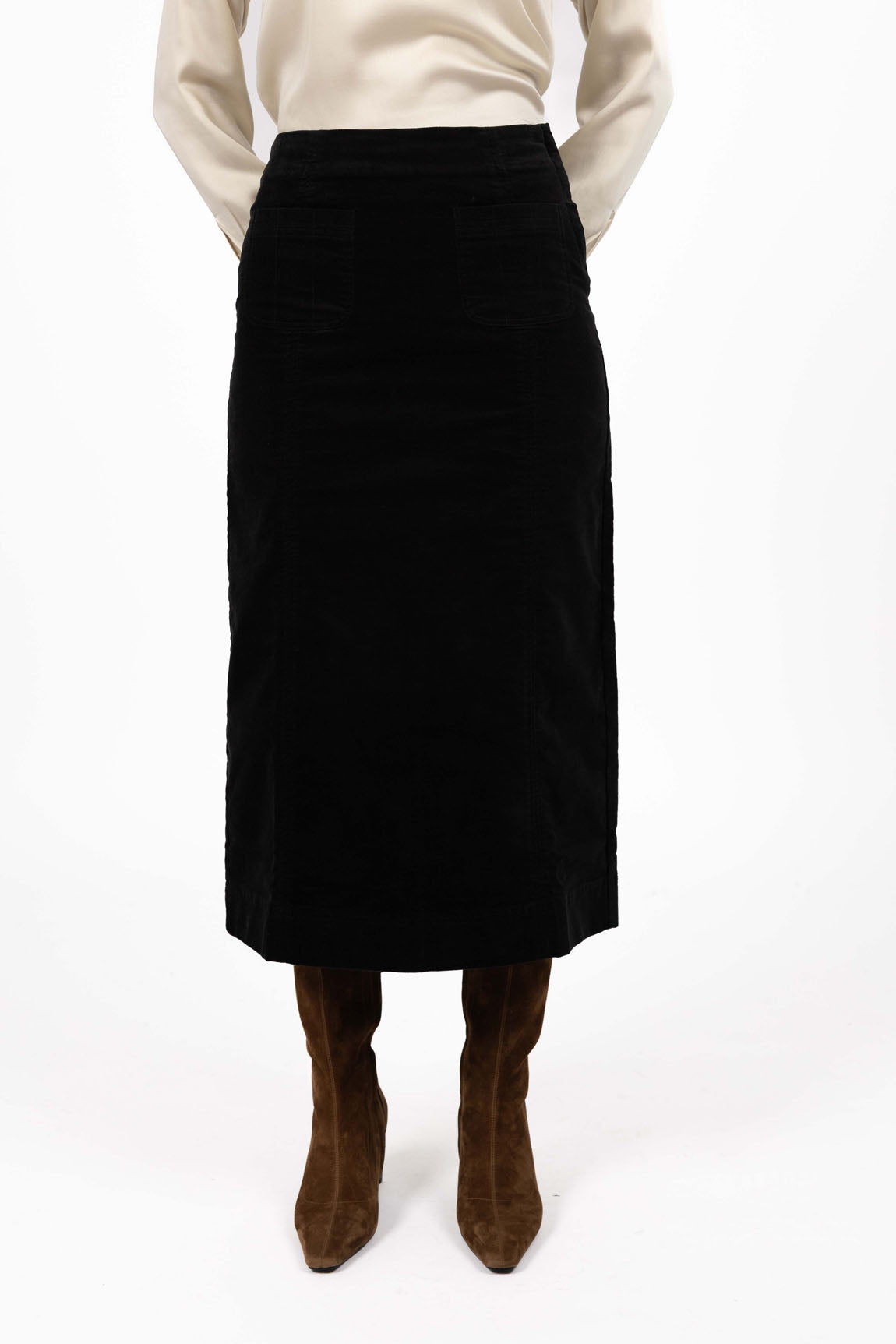 Image of Woman wearing a Humidity black skirt with a white background