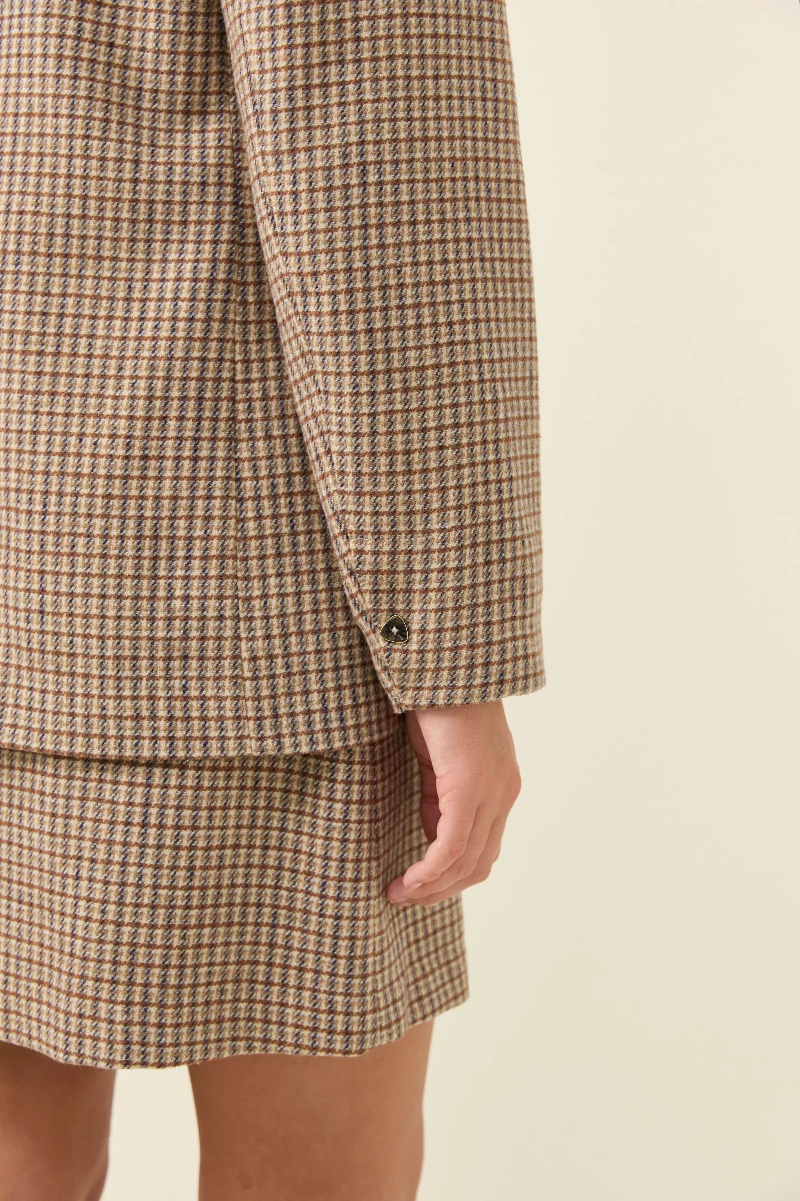 Image of isle of Mine Plaid suit jacket and skirt on a plain background