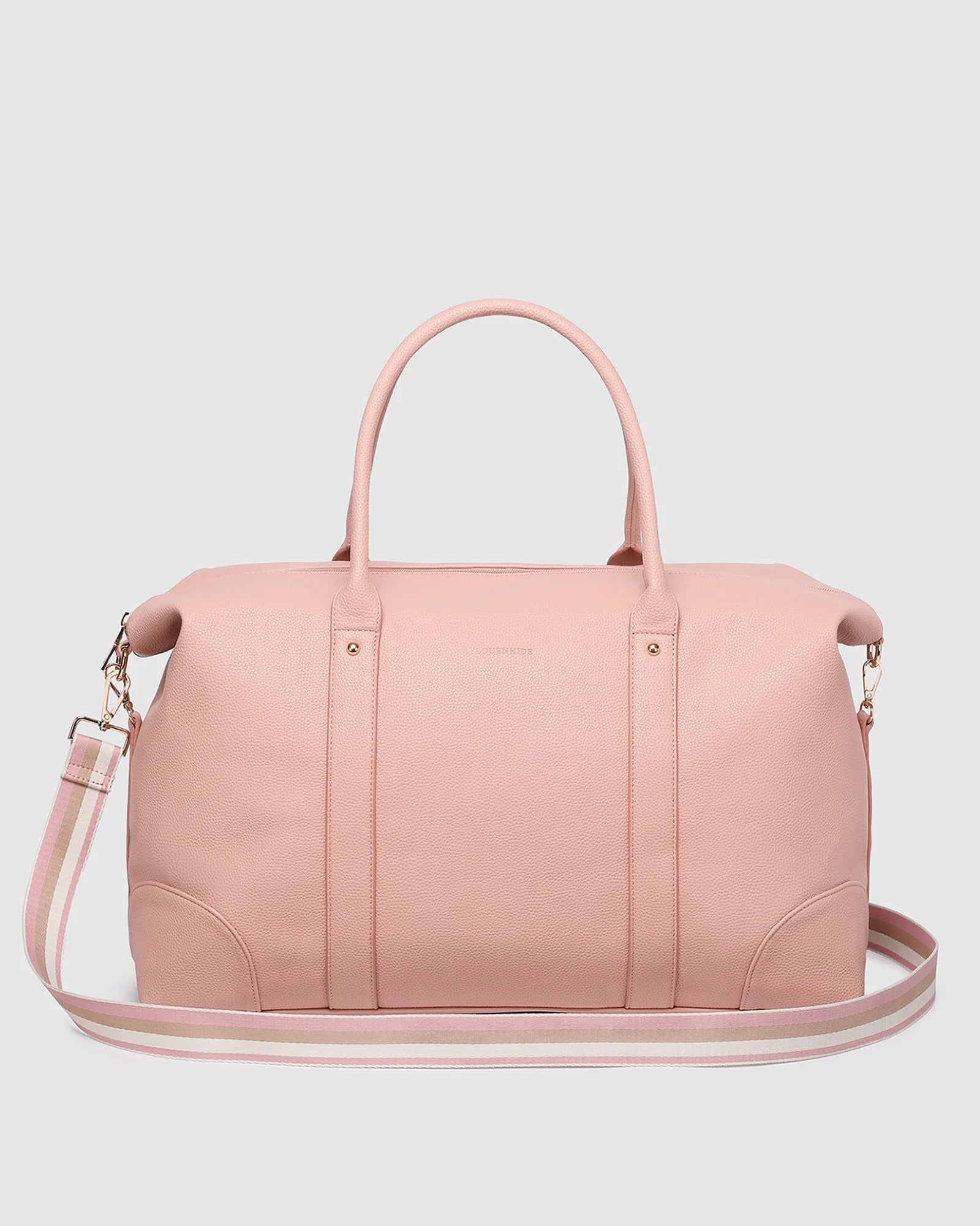 Image of A Louenhide light pink leather duffel bag with dual top handles and a matching shoulder strap, shown against a neutral light gray background.