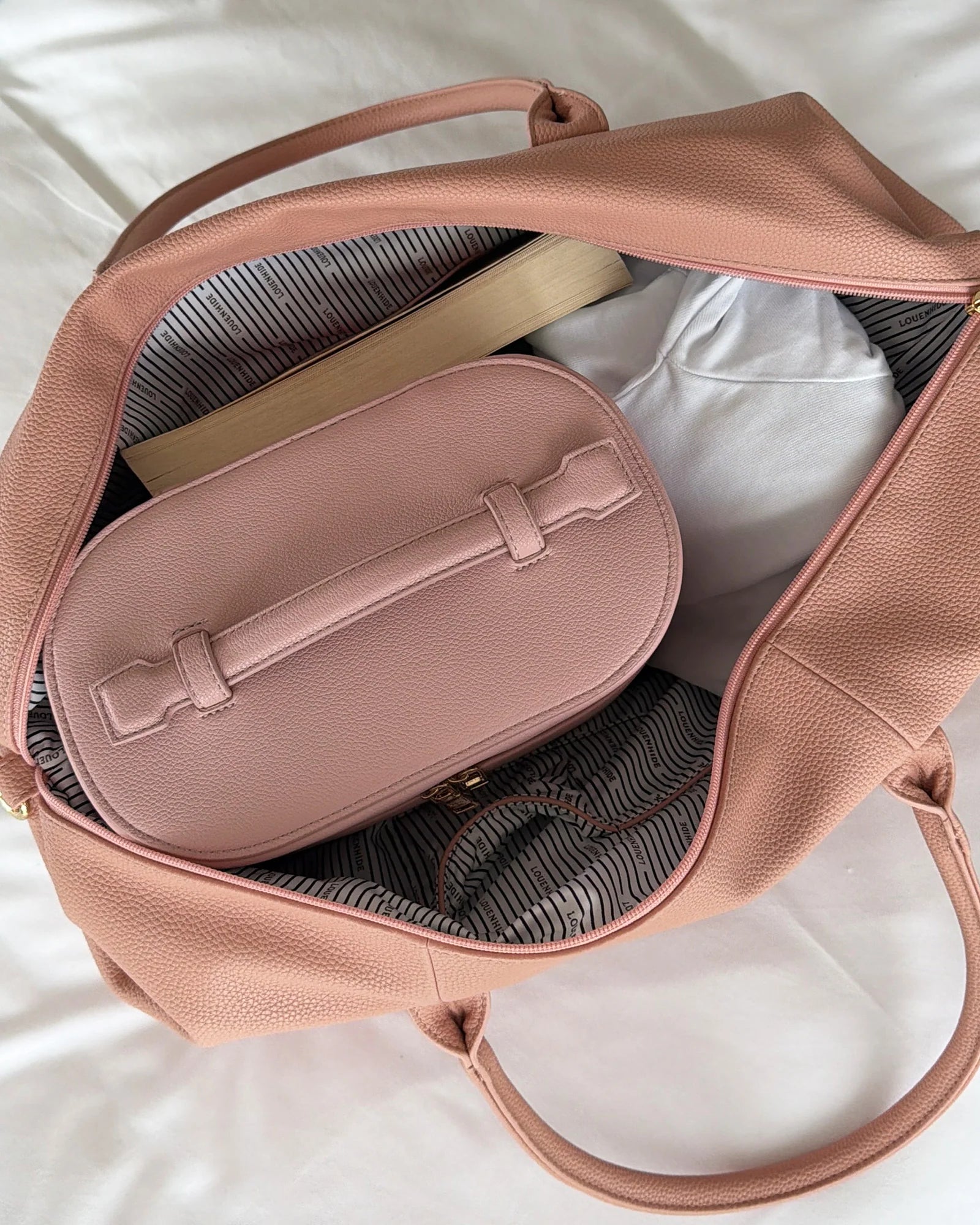 Image of Louenhide Alexis Weekender Travel Bag in Blush Stripe is the perfect companion for weekend getaways and effortless travel. Featuring a soft blush striped design