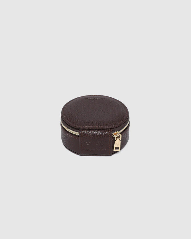 Collection of Louenhide Round brown jewelry case with a gold zipper on a light gray background in a gallery layout