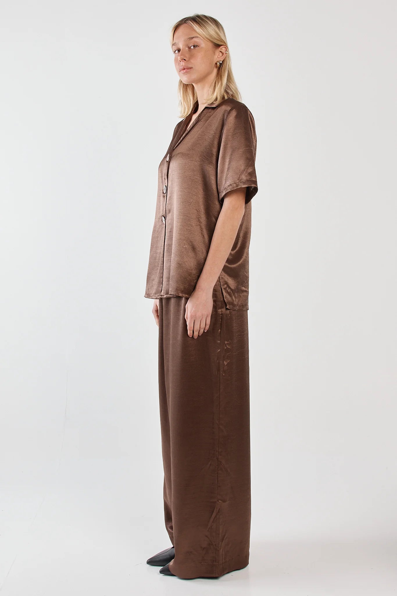 Image of Woman wearing a Sass brown outfit on a white background
