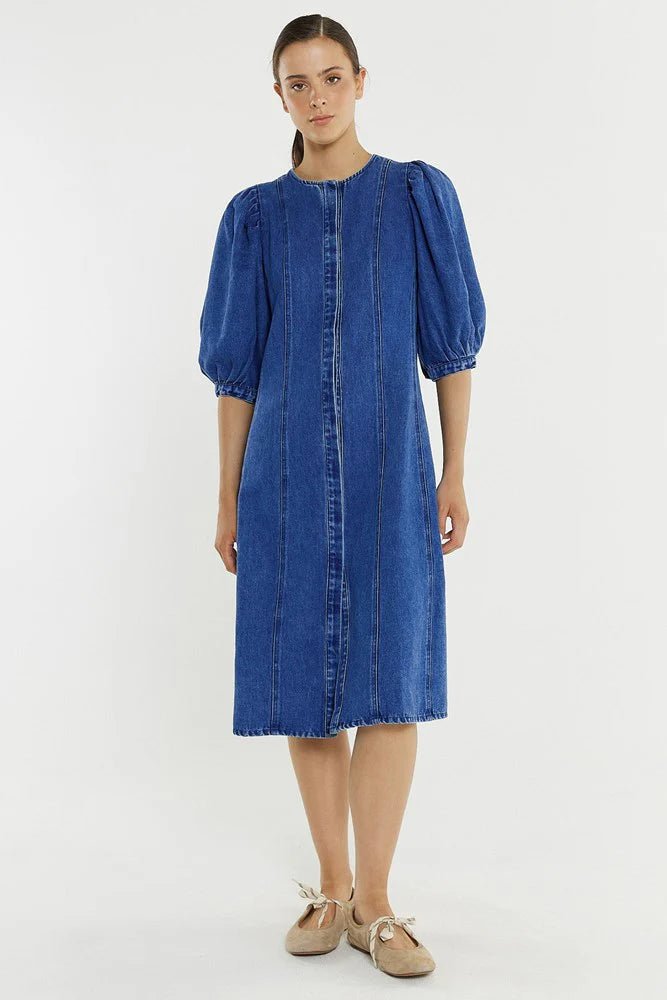 Image of Woman wearing a Sass blue denim dress on a white background