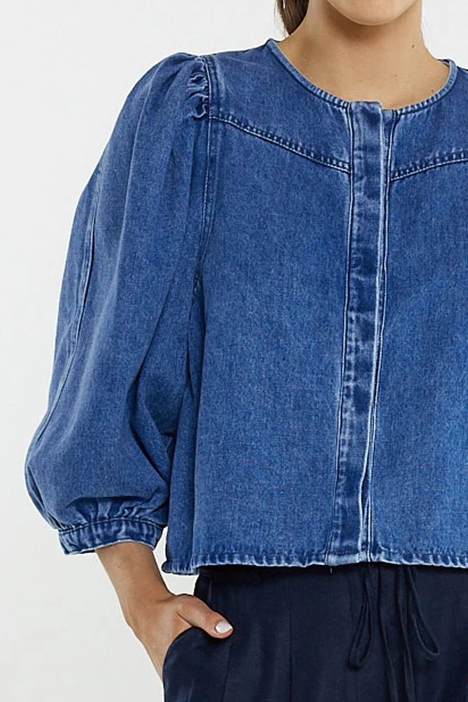 Image of Sass blue denim blouse with balloon sleeves on a white background
