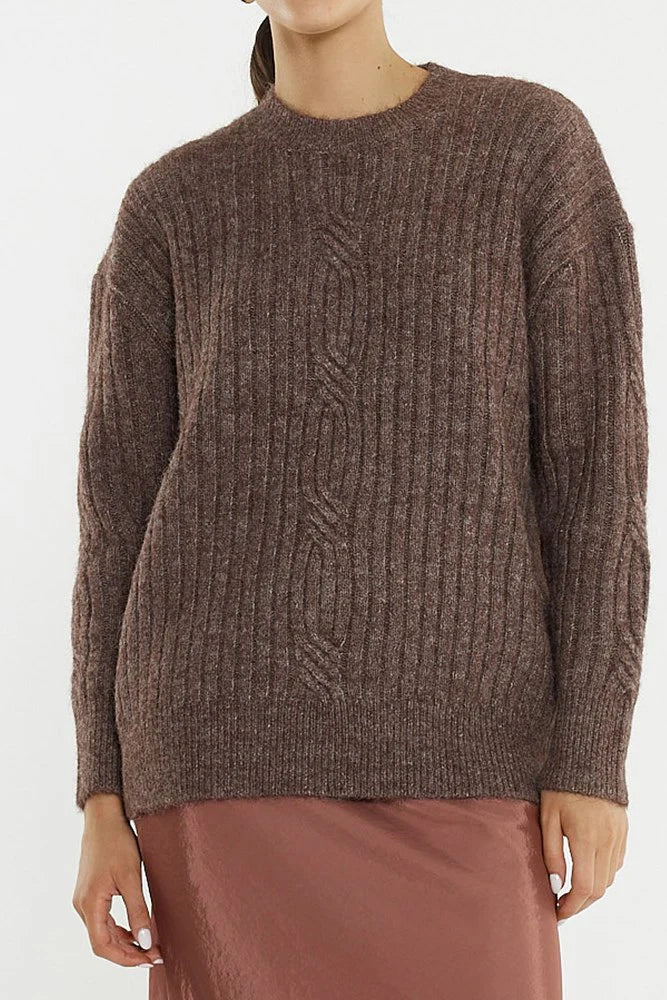 Image of Sass brown cable knit sweater worn by a woman on a white background