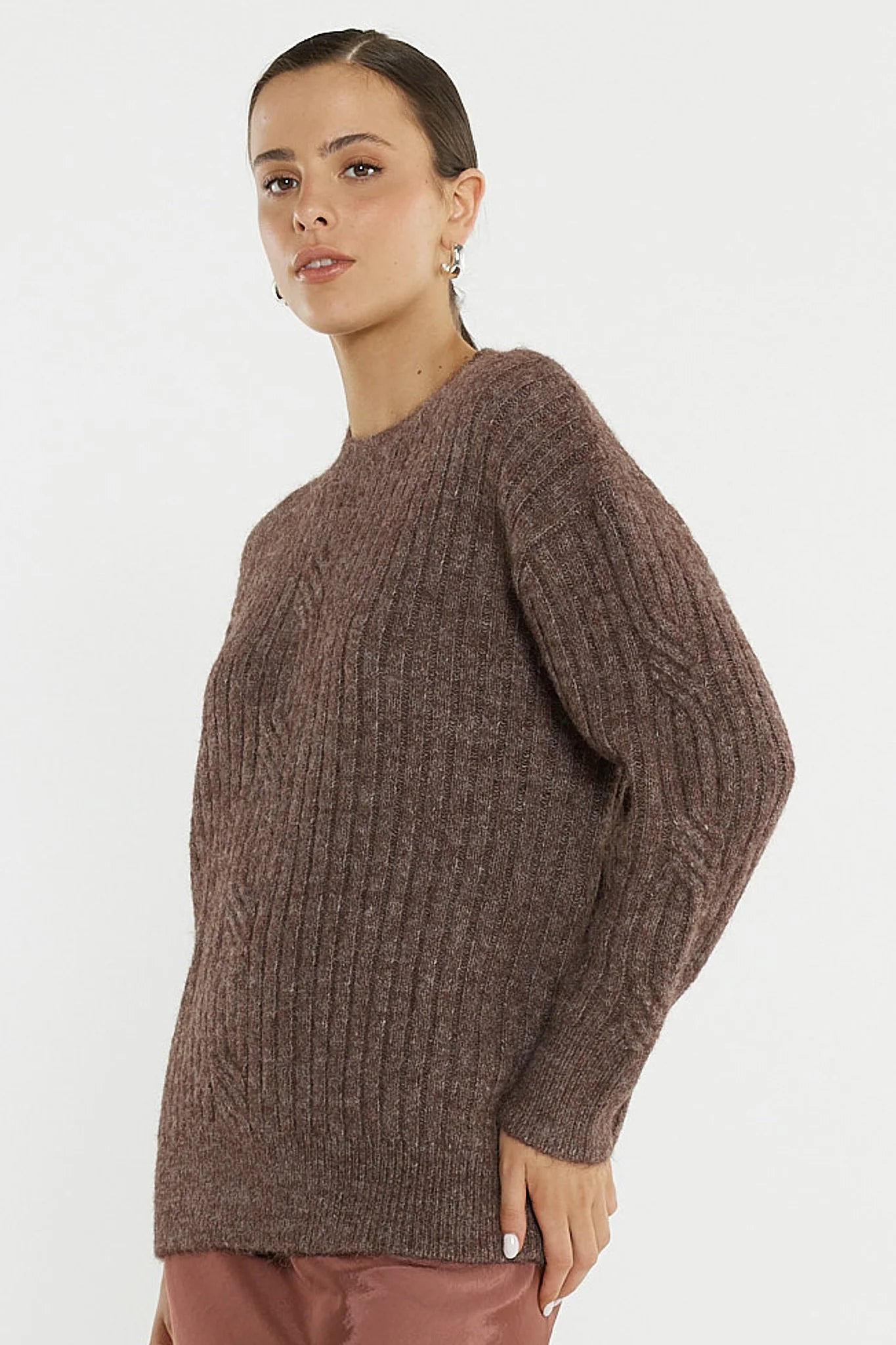 Image of Woman wearing a Sass brown ribbed sweater against a white background