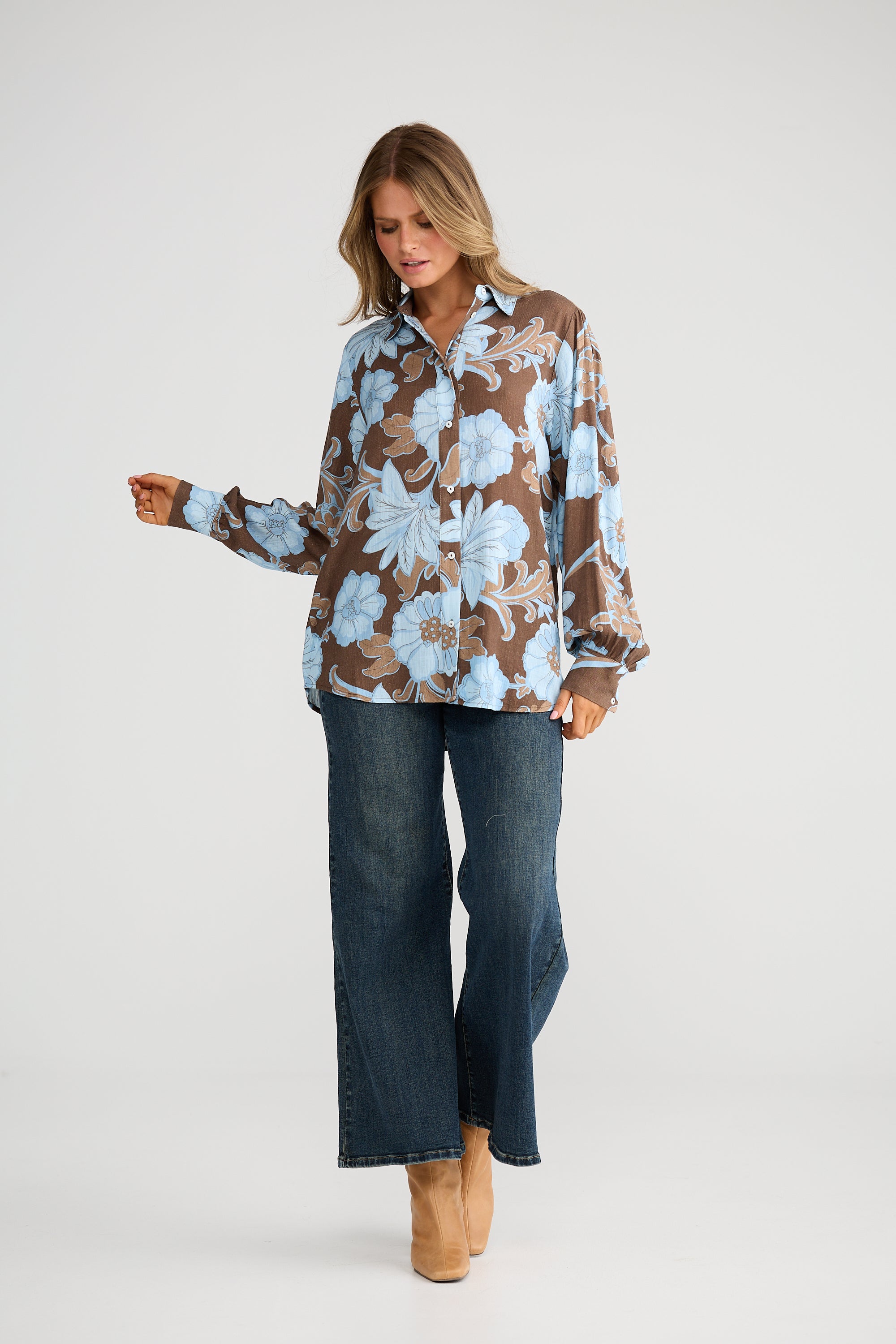 Collection of Woman wearing a Talisman floral blouse and jeans on a white background in a gallery layout