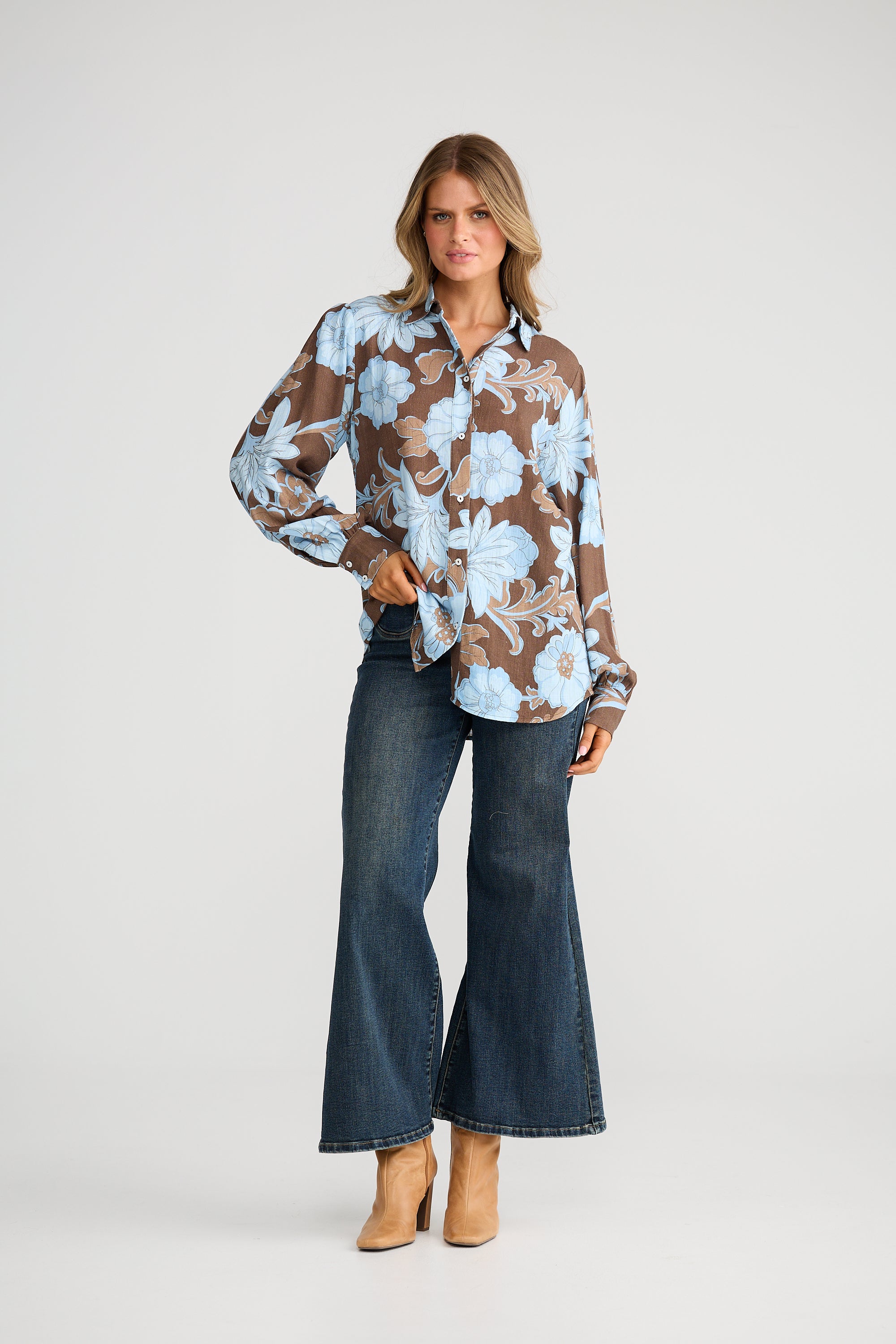 Collection of Woman wearing a Talisman floral blouse and jeans on a white background in a gallery layout