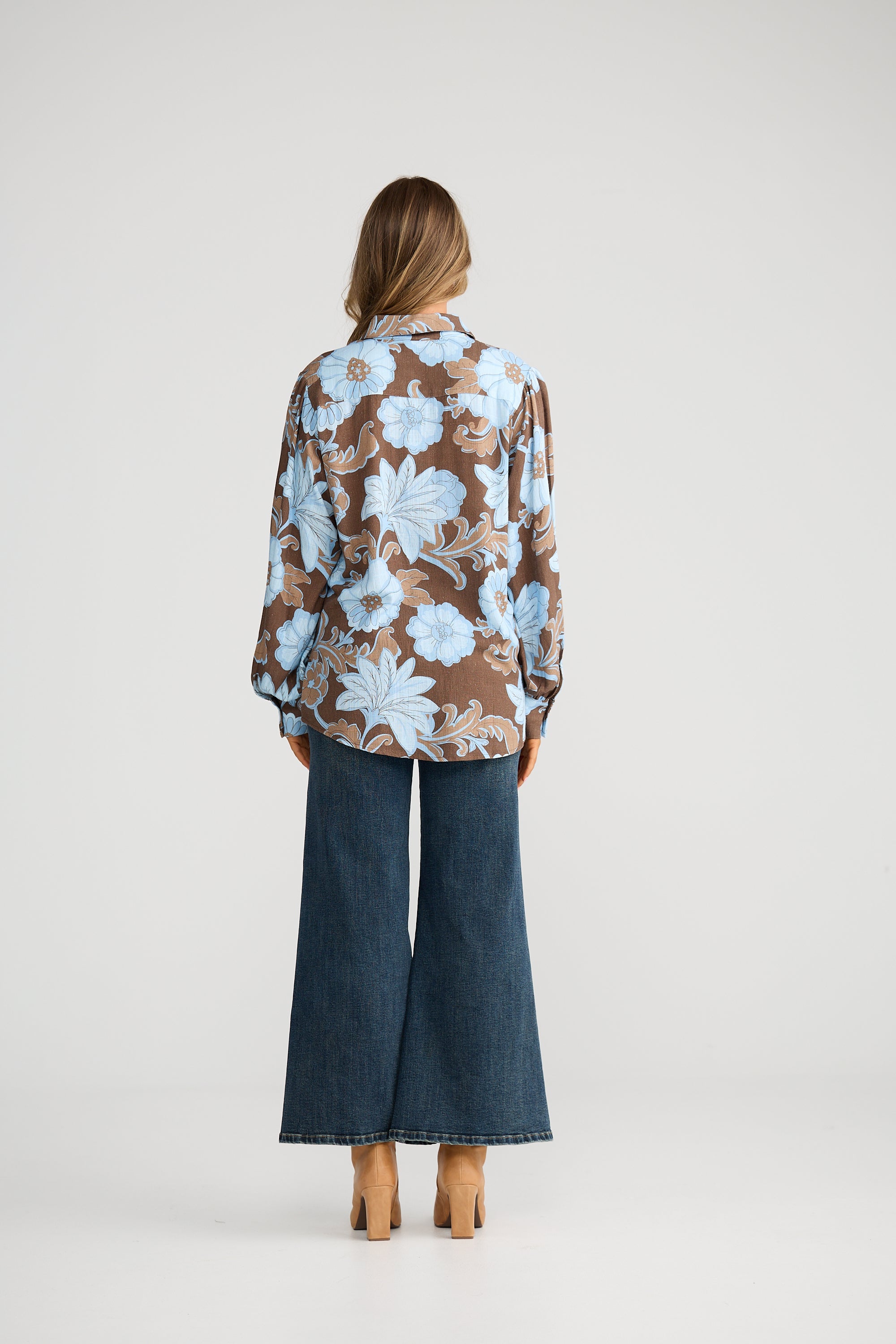 Collection of Woman wearing a Talisman floral blouse and blue jeans on a white background in a gallery layout
