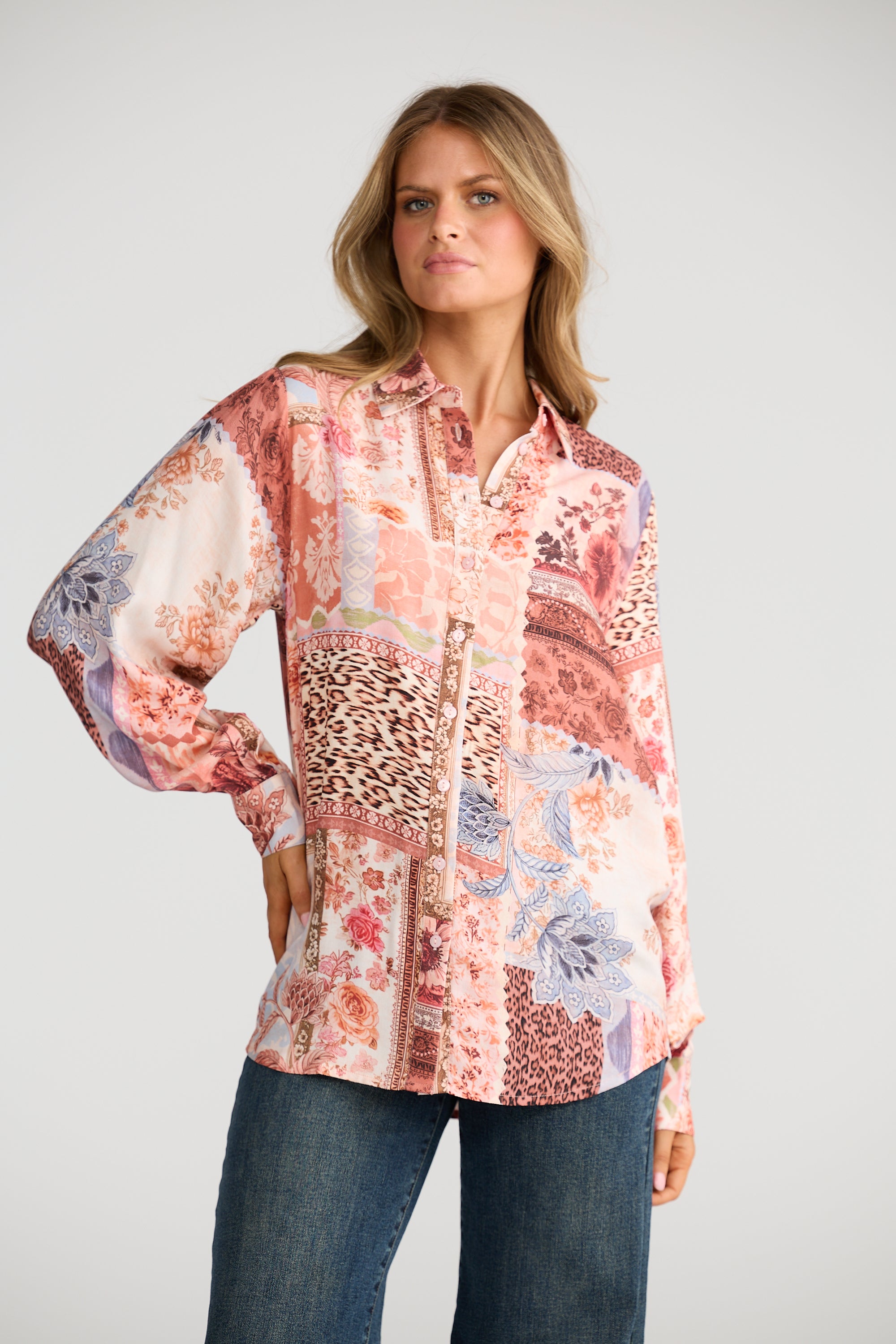 Collection of Woman wearing a Talisman patterned blouse with a neutral background in a gallery layout