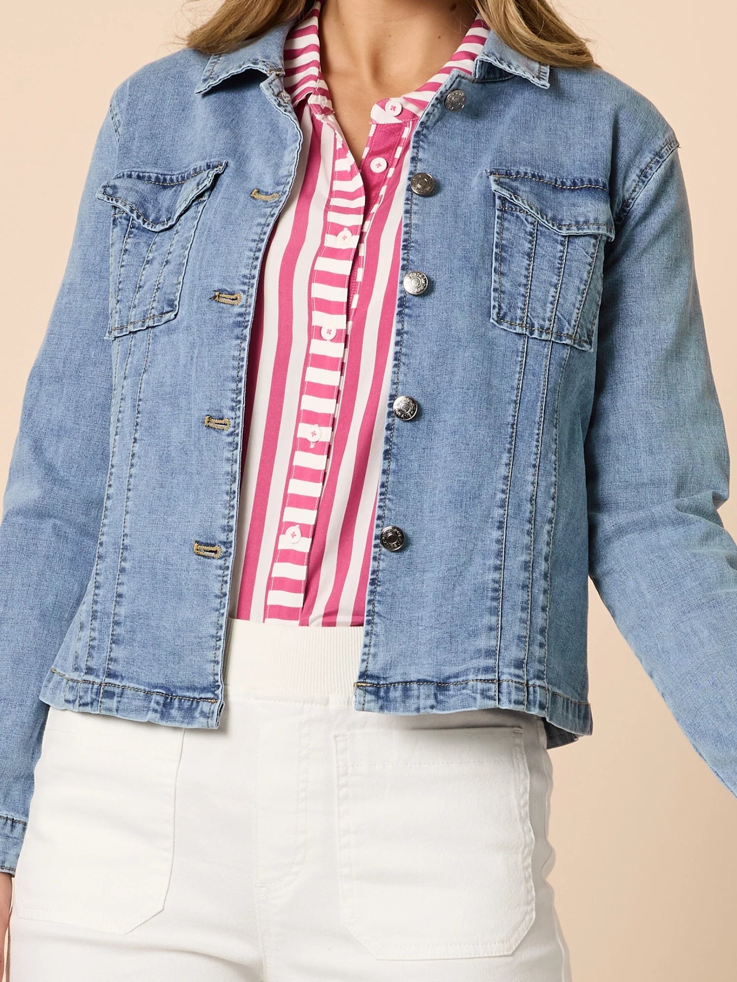 Collection of Woman wearing a Threadz denim jacket over a striped shirt with a beige background in a gallery layout
